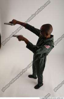 21 2018 01 ERIC STANDING POSE WITH GUNS